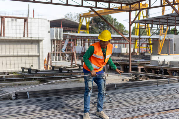 istock Foreman and workers in a construction factory 2157781718