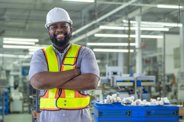 istock Foreman and workers in a construction factory 2157781753