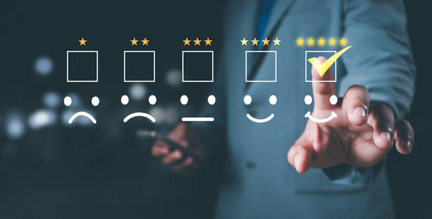 istock Customer service and Satisfaction concept ,Business people are touching the virtual screen on the happy Smiley face icon to give satisfaction in service. rating very impressed. 2157782869