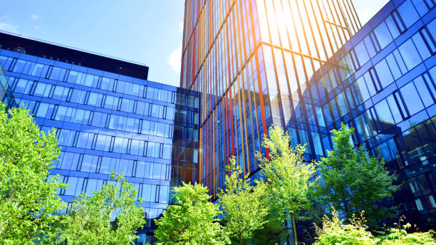 istock Sustainable glass office building with trees for reducing carbon dioxide. 2157783935