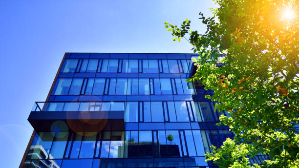 istock Sustainable glass office building with trees for reducing carbon dioxide. 2157783976