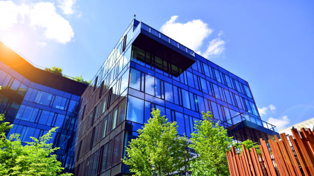 istock Sustainable glass office building with trees for reducing carbon dioxide. 2157783979