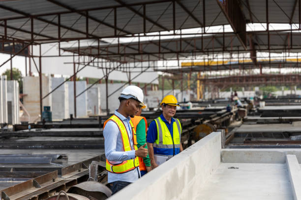 istock Team of workers in a construction factory 2157784254