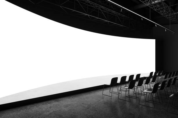 istock Row of seats and wide format mock up blank screen with stage 2157784794