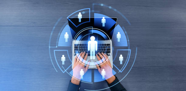 istock Man hands using laptop computer, people profile icons in glowing circle 2157785029