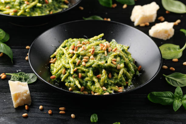 istock Trofie pasta with creamy spinach sauce and toasted pine nuts 2157787866