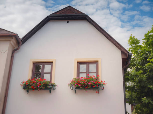 Perchtoldsdorf, Austria - July 22, 2023.  facades of old building  with flowers in  city center Historical old  Town of Perchtoldsdorf, Moedling district, Lower Austria.