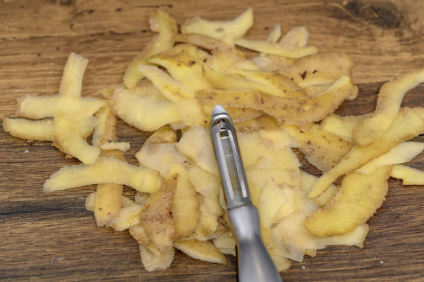 Isolated potato peel peelings lie on the table