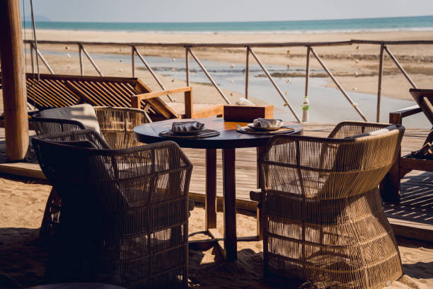 istock A cozy beach cafe with couch and rustic chairs 2157788877