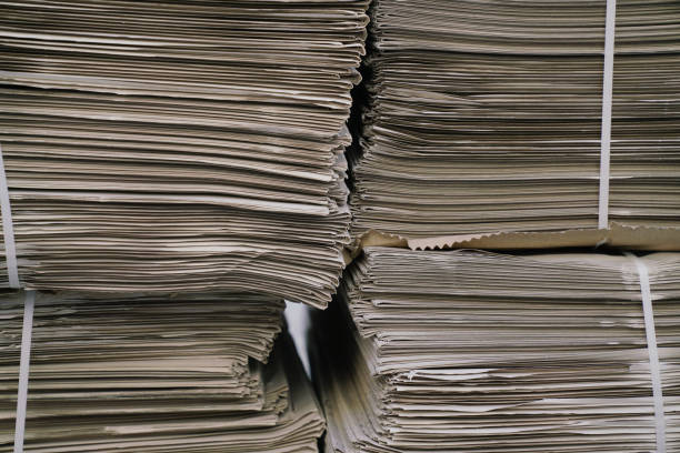 istock close up newspapers folded and stacked background on the table 2157789877