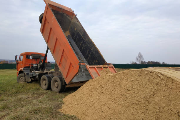 istock A large orange dump truck unloads the sand 2157790199