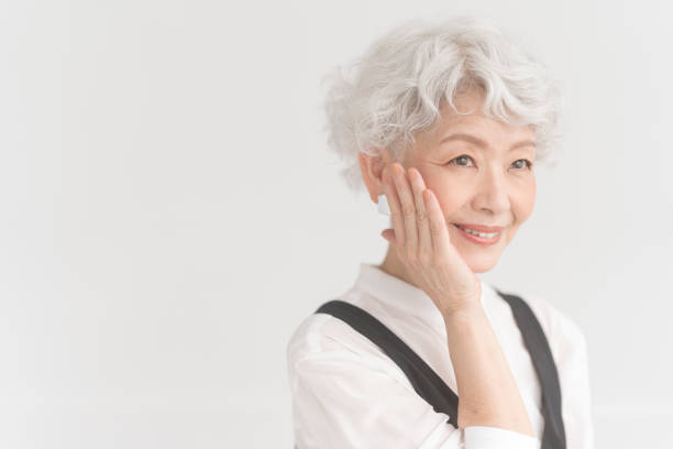 istock An elderly Asian woman is putting her hand on her cheek. 2157790339