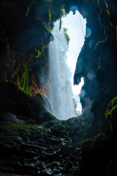 istock Inside the waterfall in the Iris Grotto at the Cola de Caballo Waterfall in the Monasterio de Piedra Natural Park, Aragon 2157792078