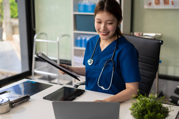 istock Doctor work on digital tablet healthcare doctor technology tablet using computer in a modern office  in the morning at the desk. 2157792435