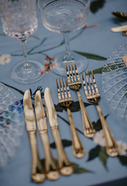 Elegance table setting in blue and gold color. Close up, flat lay.