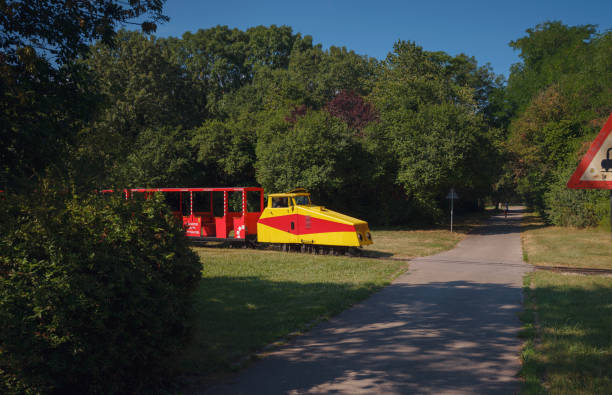 Vienna, Austria - 27 July 2023: Travel to Vienna, Austria. bright train in the Park Papstwiese Danube