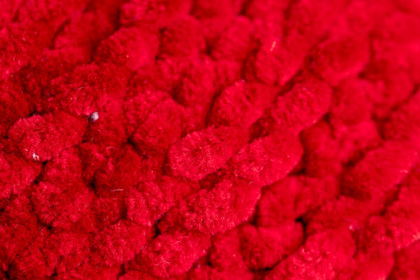 istock new soft red threads with traces of other threads in close-up 2157795943