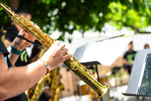Midsection Of Men Playing Trumpet