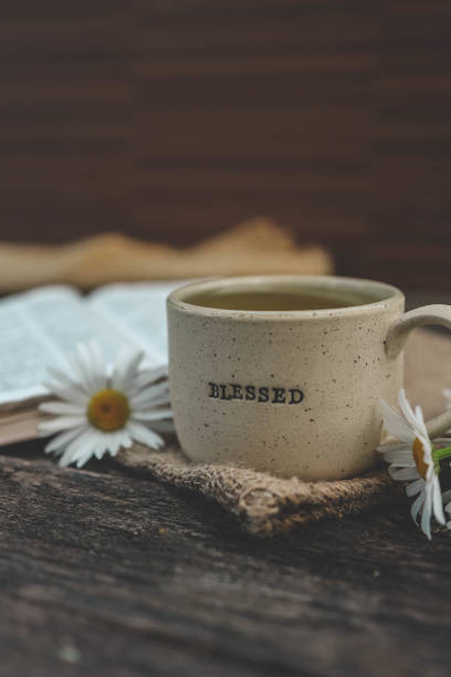istock Cup with the inscription blessed and open Bible, Christian concept 2157801446