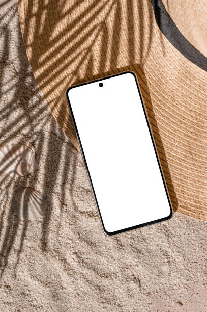 istock Aesthetic tropical summer business branding template, mobile phone empty screen mockup, straw hat on sand beach texture background with natural palm tree foliage sunlight shadow 2157803616