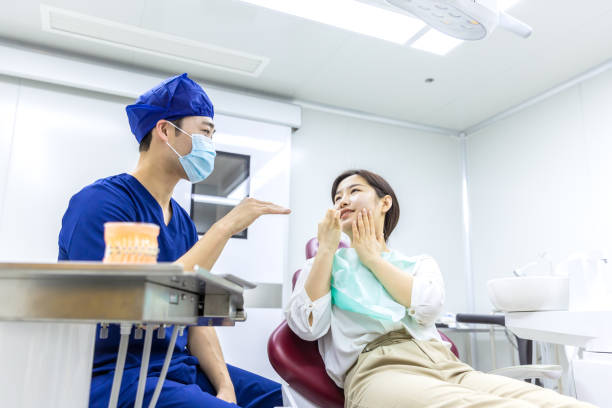 istock Dentist Examining Teeth to Female Patient 2157803718