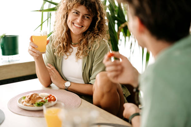 istock Happy couple enjoying breakfast together 2157804449
