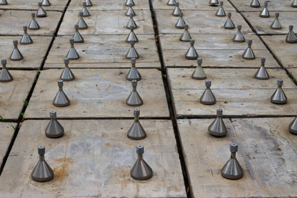 istock jet nozzles on concrete slabs, street fountain, pattern 2157804839