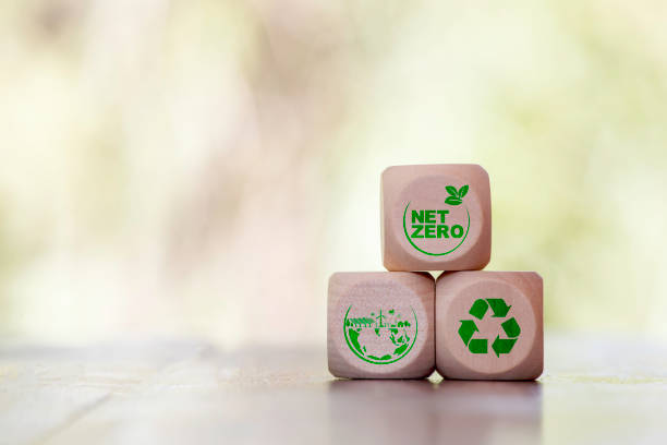 istock Net zero icon at wood box on green leaf blur in golden light morning. net zero for environmental, social, sustainable and ethical. Net zero emission Idea innovative carbon neutrality in 2050. 2157805635