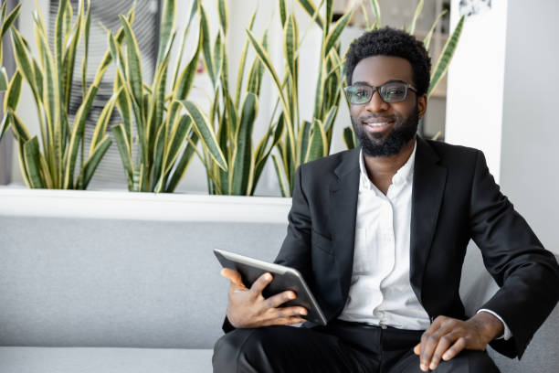 istock African american businessman in a black suit looking confident and determined 2157806316