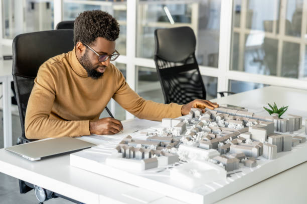 istock African american architect working in his office and looking involved 2157806402