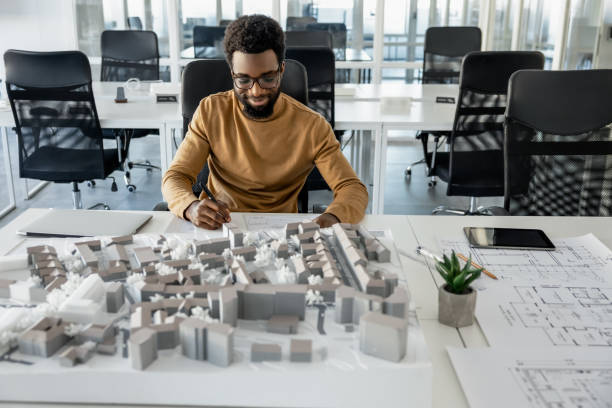 istock African american architect working in his office and looking involved 2157806407