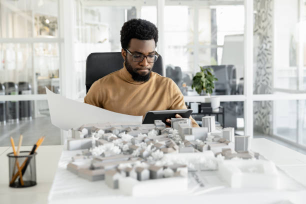 istock African american architect working in his office and looking busy 2157806435