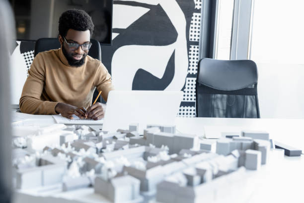 istock African american young man working in the office and looking busy 2157806463