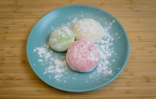 istock Different color delicious Japanese mochi on the blue plate 2157808704