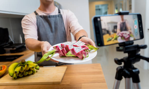 istock The chef is broadcasting live from workshop how to cuts and peels dragon fruit 2157811764