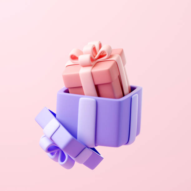 istock Gift box with ribbon is open, with a smaller gift box with bow sitting inside 2157812050