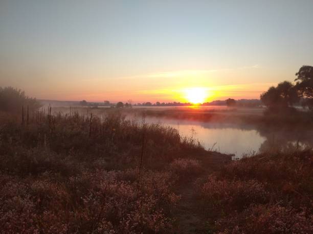 istock sunrise on the river bank. Dawn. 2157814289