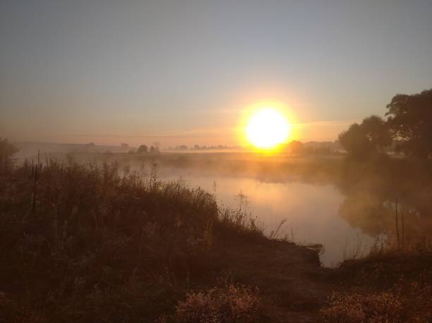 istock sunrise on the river bank. Dawn. 2157814290