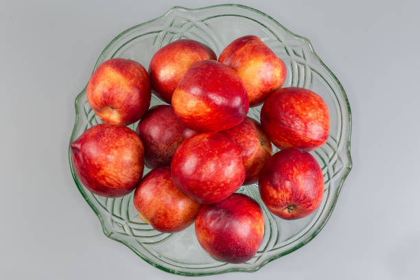 Group of nectarines on white background. Selective focus, shallow DOF.