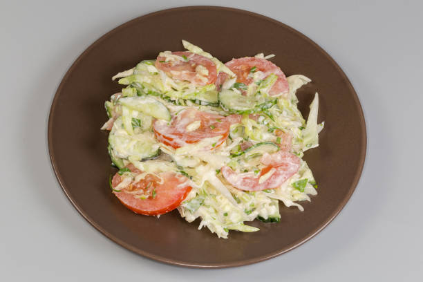Tomatoes on shredded cabbage.
