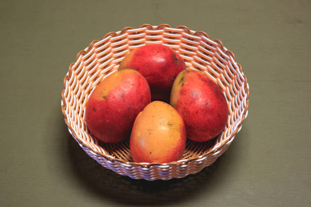 tray with peaches on a green wooden table