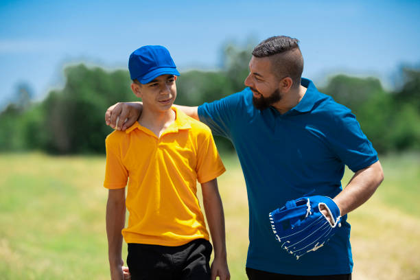 istock Father and son talking with baseball glove 2157818620