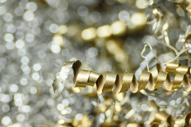 Close-up scene of  the metal materials scrap from turning process. The pile of lathe chips.