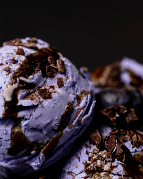 istock Purple ice cream scoops are studded with chocolate chips. Macro photo. 2157822349