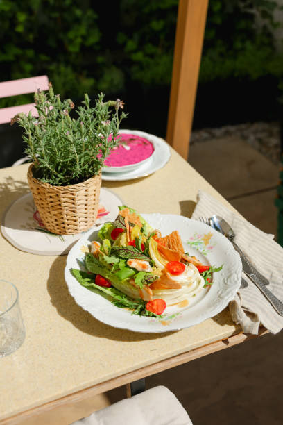 istock Serving Fresh Chicken Salad at Sunny Restaurant Terrace 2157822621