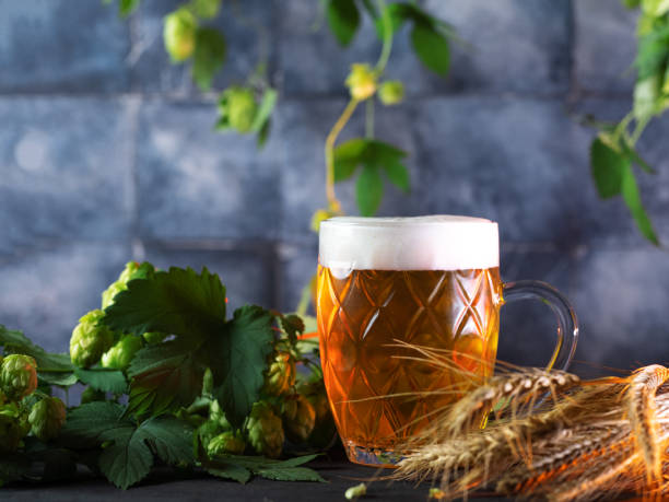 istock Beer mug on the table with green hops 2157824224
