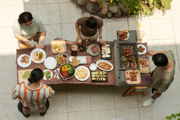 istock Friends Cooking Meal Together 2157825024