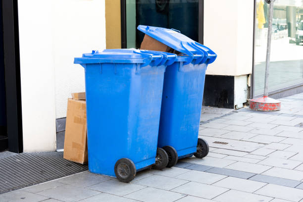 istock blue trash can at a side walk in munich 2157825105