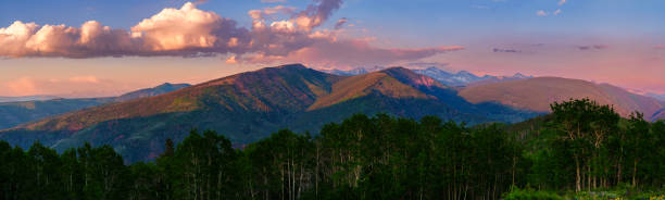 Gore Range and Sawatch Range Mountain Panorama - Scenic summer landscape at sunset with alpenglow of rugged snowcapped peaks near Vail and Beaver Creek, Colorado USA.