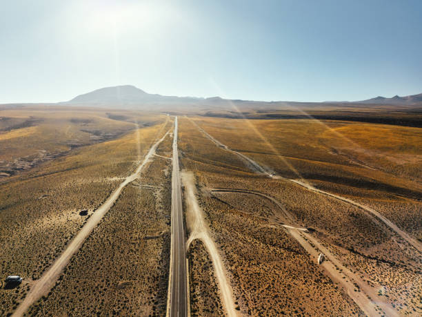 istock Sunlit Desert Road in the Atacama, Chile Under a Vast Clear Sky 2157826556